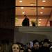 A Michigan faculty member looks out a window to check the scene outside Crisler Center on Sunday, March 31. Daniel Brenner I AnnArbor.com